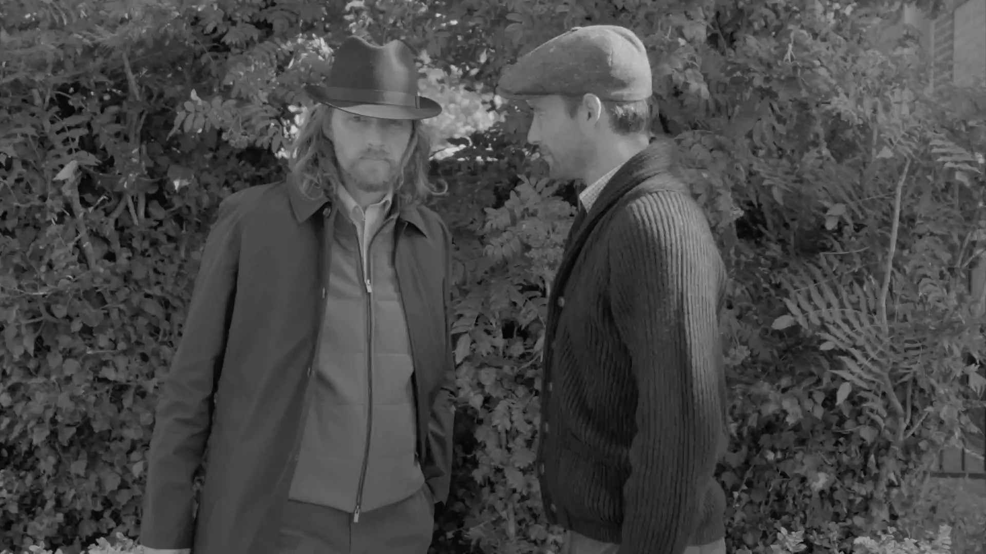 two men wearing outwear